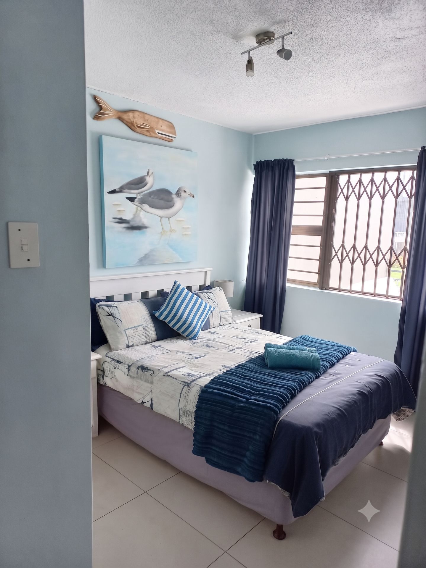 Master bedroom with coastal decor